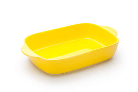 Empty yellow bowl isolated on white backgroundの写真素材