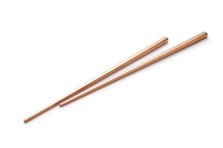 rose gold chopsticks isolated on white background.の写真素材
