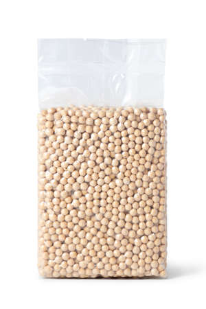 Soybeans in transparent vacuum sealed bag isolated on white background.の写真素材