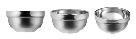 Empty stainless steel bowl isolated on white background.の写真素材