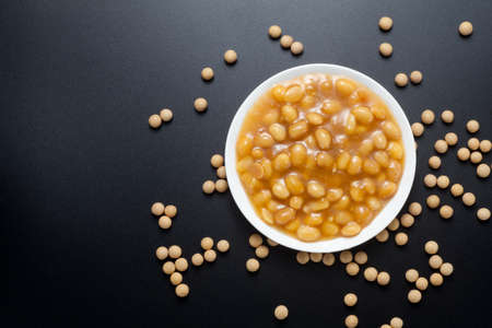 Soybean paste in a dish on black background. Top view.の写真素材
