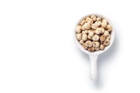 Sichuan Fritillaria cirrhosa (Chuan bei mu) in a ceramic dish. Isolated on white background. Chinese herbal medicine. Top view.の写真素材