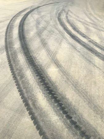 Traces of car tires on the roadの写真素材