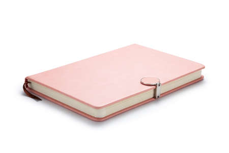 Pink notebook with a magnetic lock on white background.の写真素材