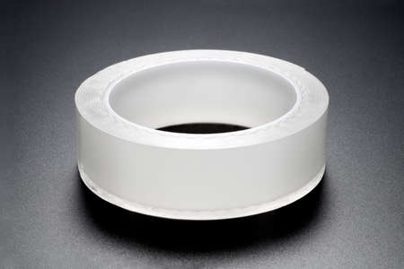 Transparent double-sided tape on black background