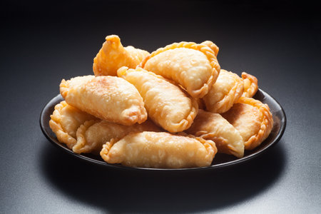Crispy dumplings âin a black plate, characteristic traditional snack of Guangdongの写真素材