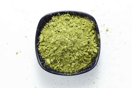 Matcha green tea powder in a black dish. Top view.の写真素材