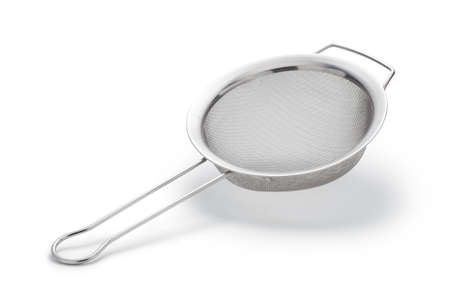 Metal sieve isolated on a white backgroundの写真素材