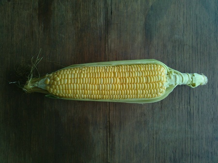 Peel corn on table