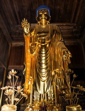 Nice gold statue of buddha in wooden japanese templeのeditorial素材