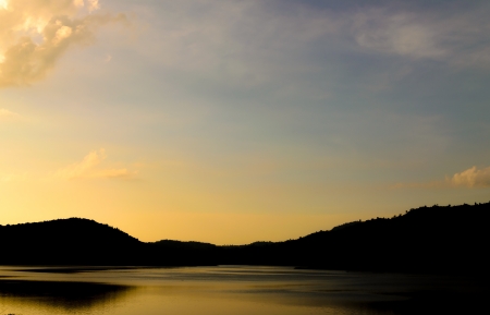 Silhouette of lake and hillsの写真素材