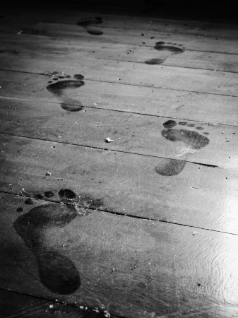 close up step forward on dusty floor monochromeの写真素材
