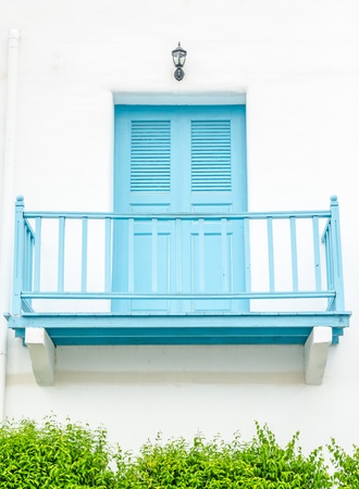 renovated facade blue balcony  on white wallの写真素材
