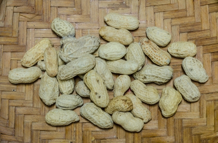 top view of peanut on wicker basket background