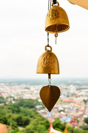 bells of Buddhist temple in Thailandの写真素材