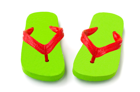 Pair of green flip flop isolated on white backgroundの写真素材