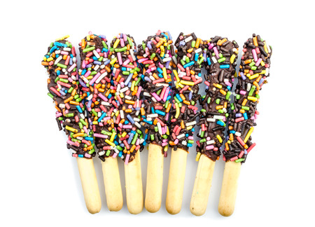 crispy sweet straw covered chocolate with colorful sugar sprinklesの写真素材