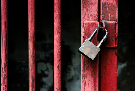 master key locked on grunge iron gateの写真素材