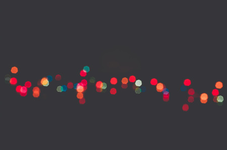 Abstract background with bokeh defocused lights and shadow.の写真素材
