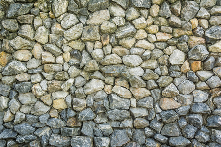 real stone wall surface with cement for background