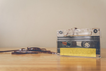 a cassette tape on wooden table  - vintage style