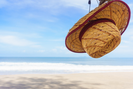 hat on beautiful beach and tropical seaの写真素材