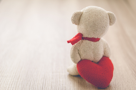 Bear with Heart on wood table,vintage tone, love conceptの写真素材