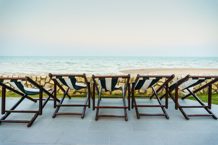 Empty beach chairs at tropical beach.の写真素材
