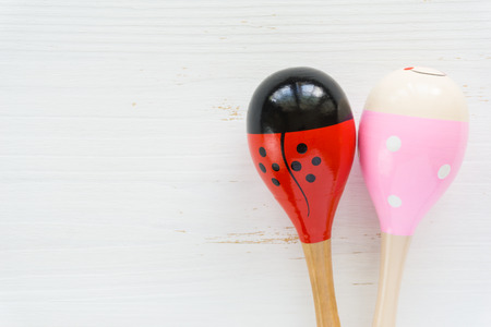 Maracas on white wooden boardの写真素材
