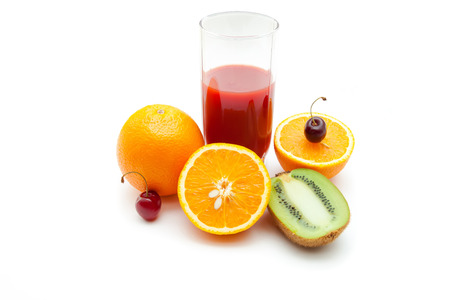 Tropical fruits and juice on white backgroundの写真素材