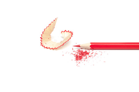 Sharpened pencil and shavings on white backgroundの写真素材