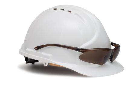 Construction helmet and safety glasses on white backgroundの写真素材
