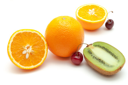 Tropical fruits and cherry over whiteの写真素材