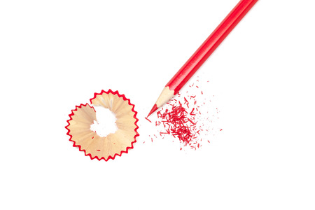 Sharpened pencil and shavings on white backgroundの写真素材