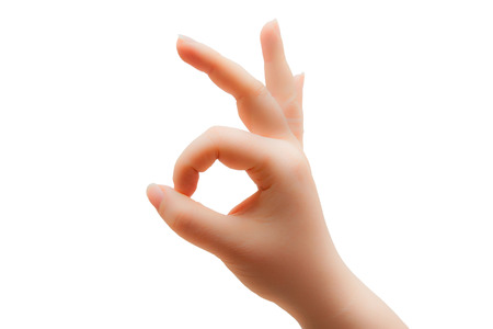 Fingers in form OK isolated over whiteの写真素材