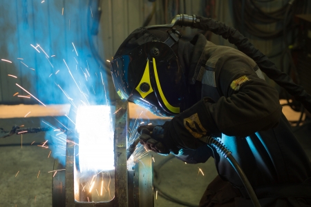 welder in protective mask weld details