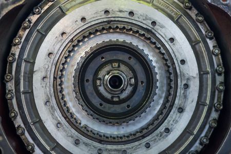 round metal piece. part of a large truck