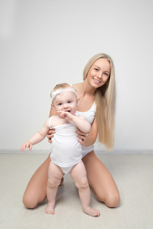 mother with her baby studio shotの写真素材