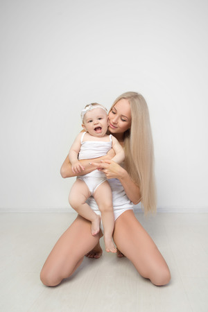 mother with her baby studio shotの写真素材