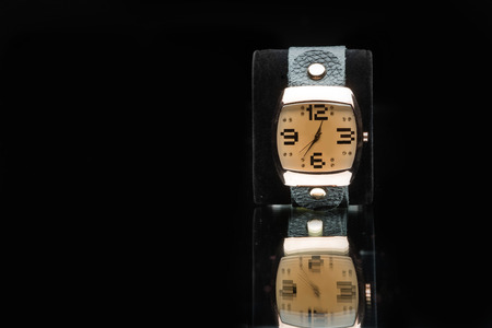 gold watch isolated on black backgroundの写真素材