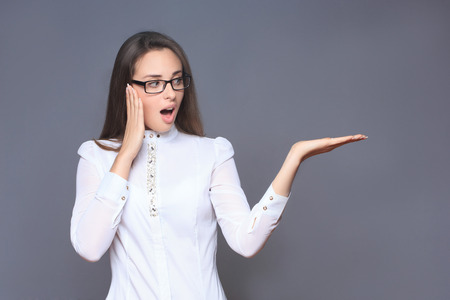 woman pointing her finger on imaginery buttonの写真素材