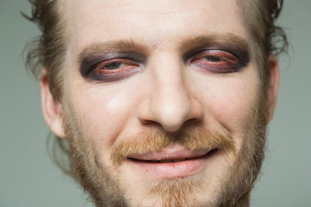 portrait of a man with hooded eyes.