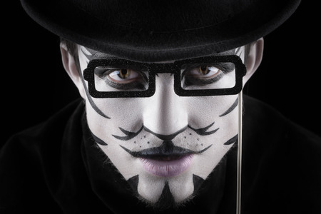 man in make-up, looks like a cat.