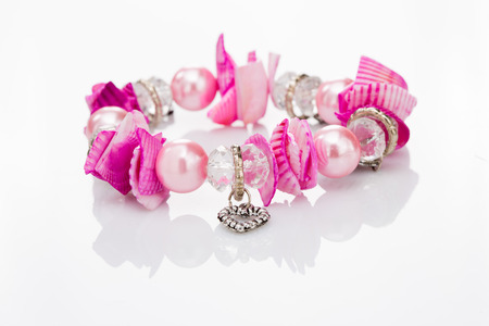 pink bracelet with pendantsの写真素材