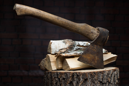 birch firewood, old rusty ax