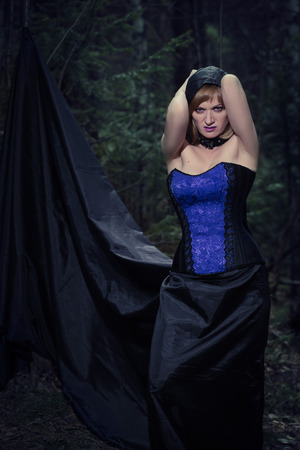 witch girl in forestの写真素材