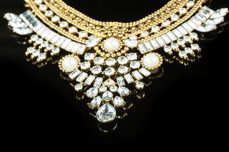 metal feminine necklace. on black  background.の写真素材