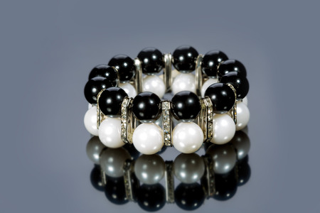bracelet of pearls on a gray backgroundの写真素材