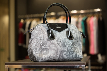 bag on a shelf in the store. dark backgroundの写真素材