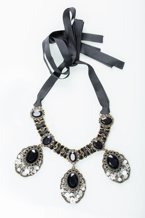 black necklace with stones  on white backgroundの写真素材
